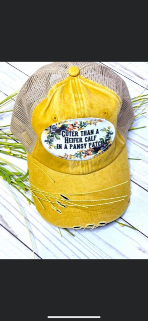 Cuter than a heifer calf in a pansy patch cap